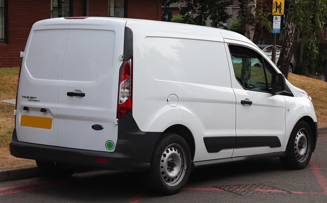 The rear of a Ford Transit Connect panel van parked in Warwick, England.